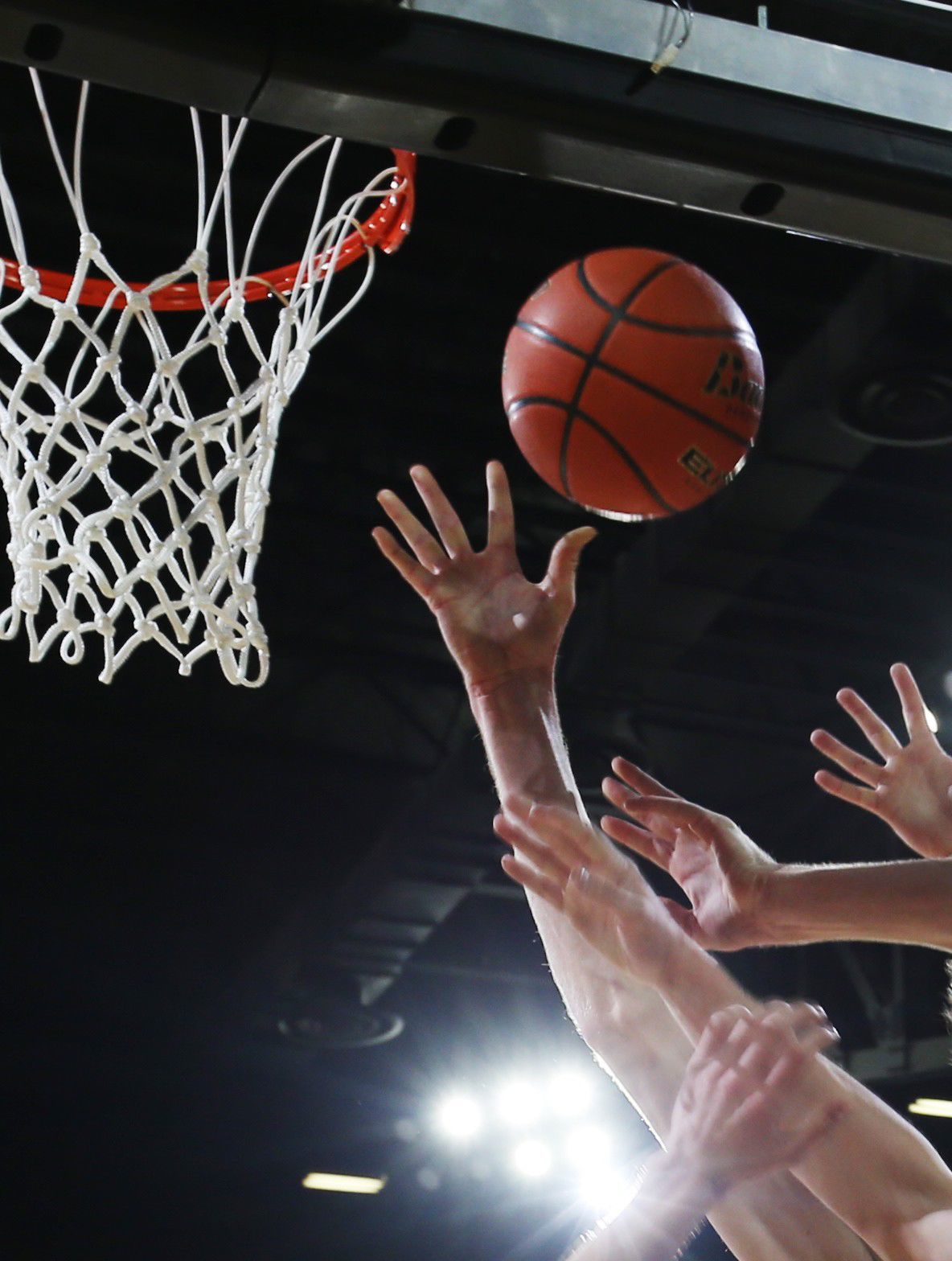 Hands reach for a rebound